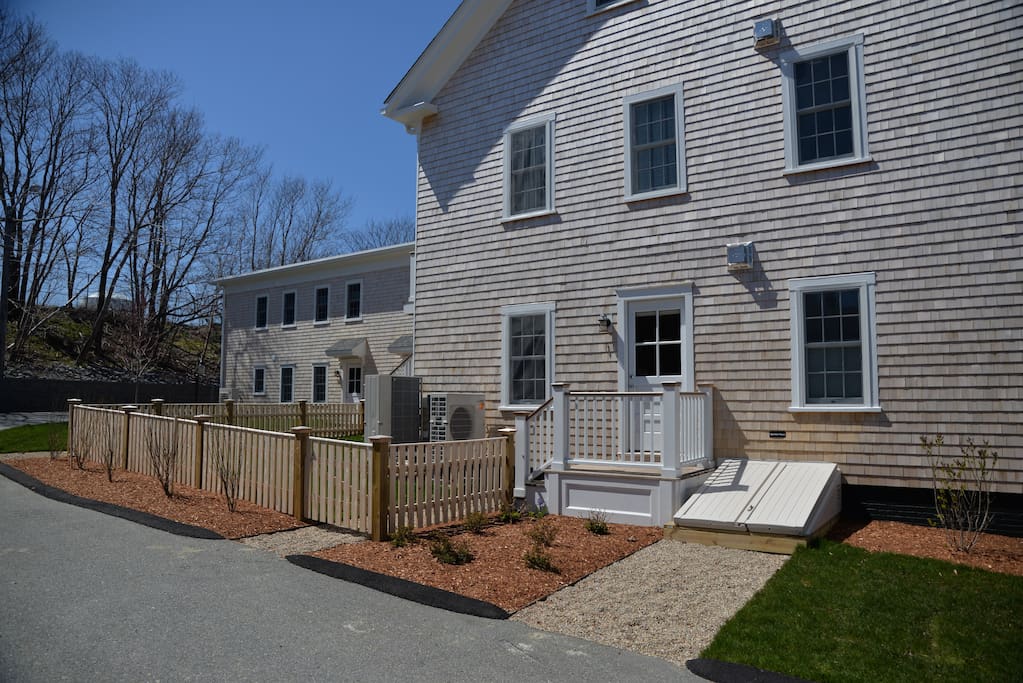 private entrance and Exclusive use fenced in yard that will contain seating and grill.
