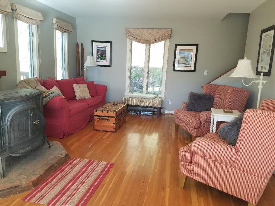 Relax on the comfortable chairs or pottery barn couch in the living room.
