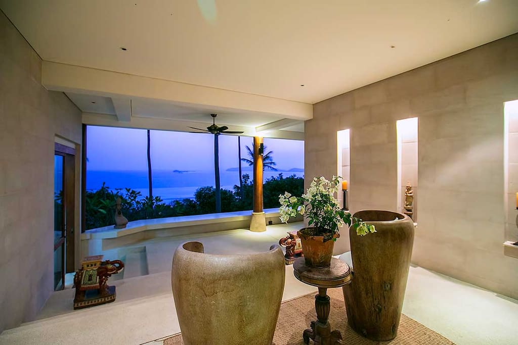 Two balinese coconut armchairs and the turquoise ocean
