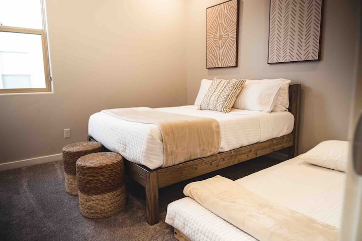 A bedrooms with the trundle pulled out from underneath the bed