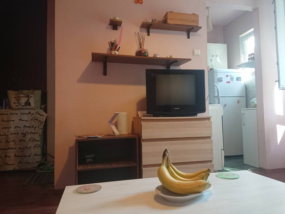 View from the sofa bed, in the left is the main entrance and the bath, in the right the kitchen