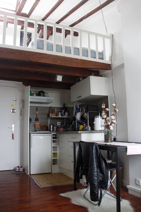 Entrance, kitchen and the open bedroom upstairs.