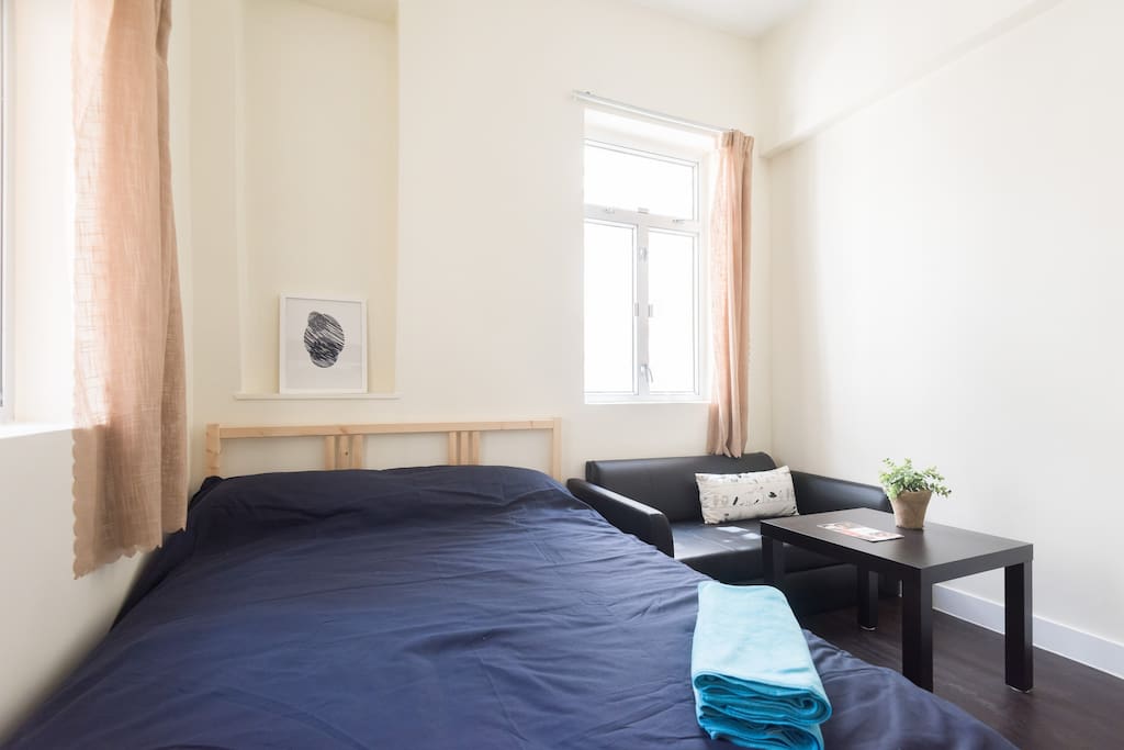 Comfy double sized bed for two will recharge you after a long day.