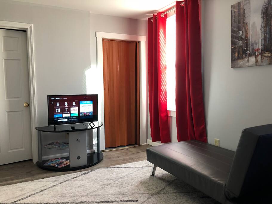 View of Tv, Bathroom, and Closet