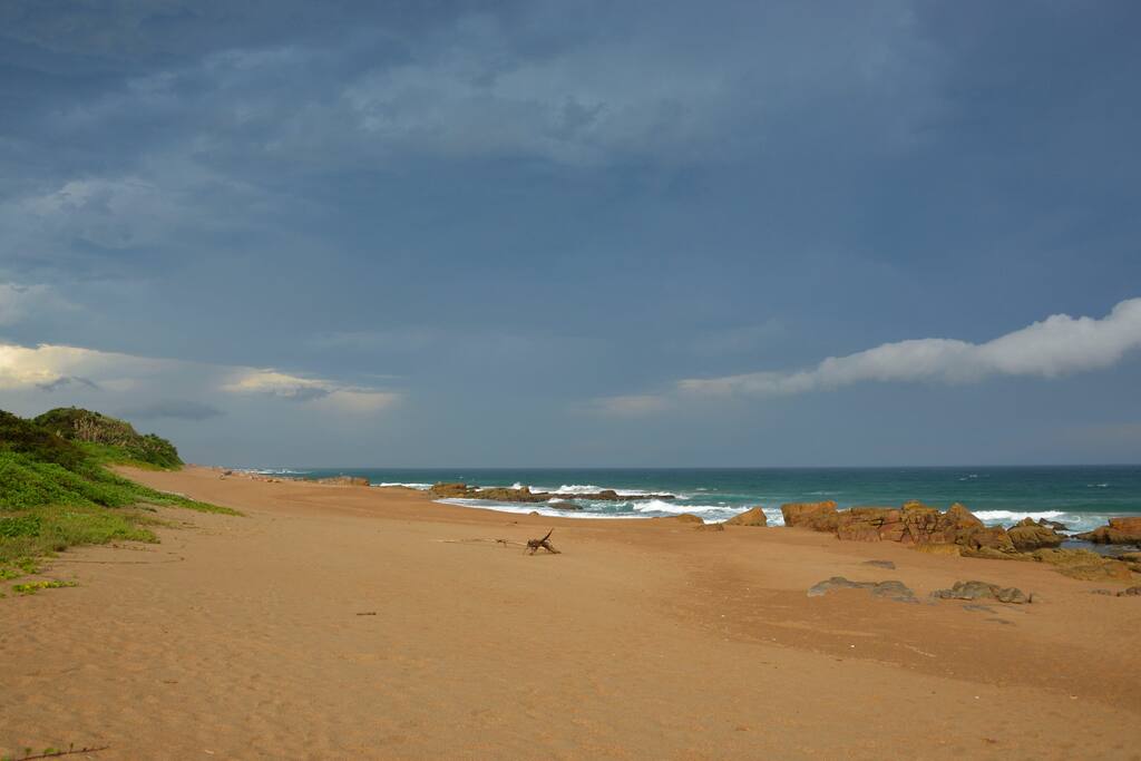 Beach in front of house