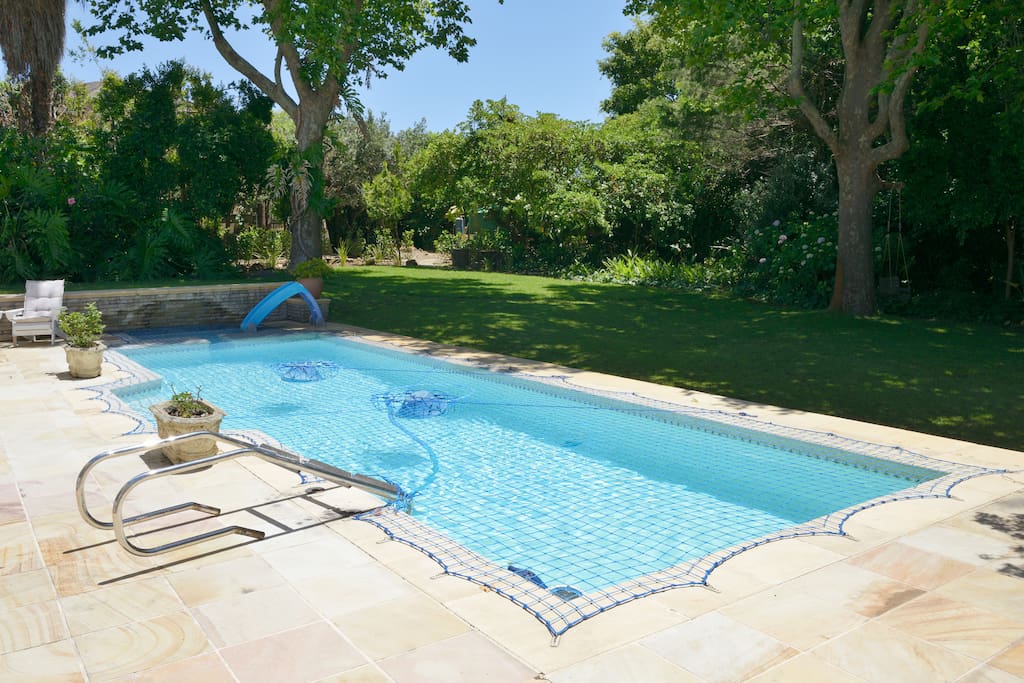 Large pool with baby pool and child safety net. Pool is heated via solar piping on the roof.