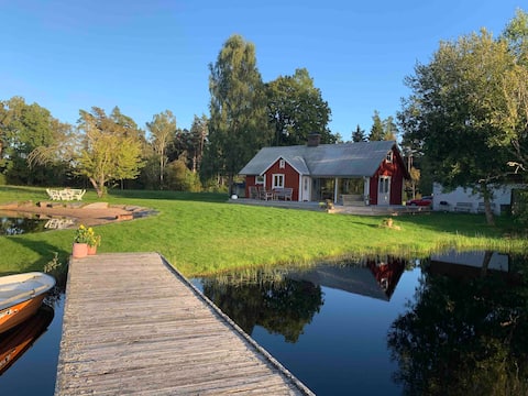 Successful Airbnb property: Cottage in forest glade with private swimming lake, beach & fishing in Örkelljunga