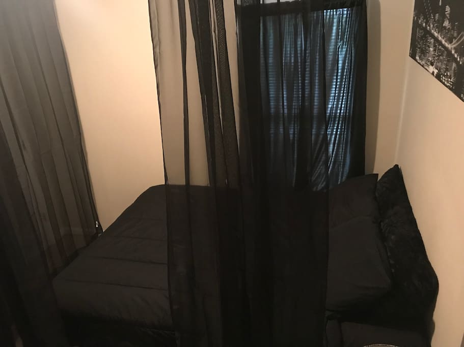 These beautiful sheers surround the bed and are separate from the door to the room
