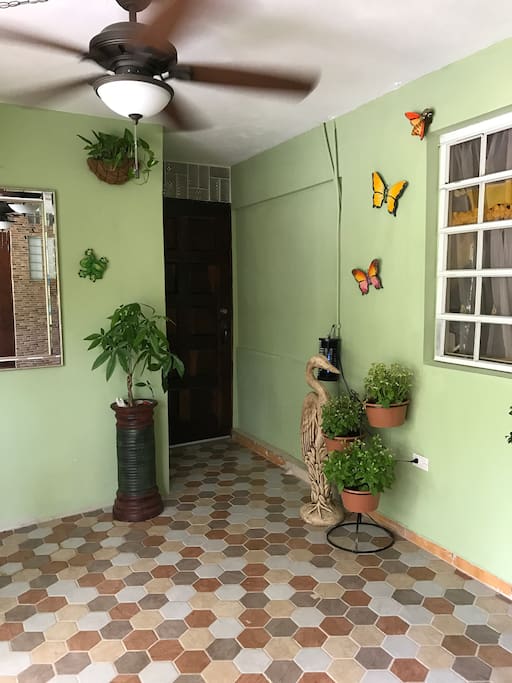 Hallway that leads to your private oasis. Has ceiling fans to feel the breeze from the mango trees. Caribbean decor and vibe. Very private and safe