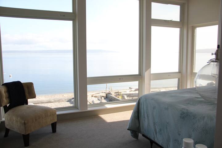 upstairs queen bedroom with amazing water views. Watch shooting stars from bed.