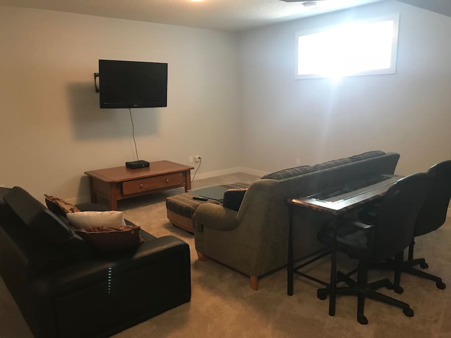 Gaming console, tv,couches and work space