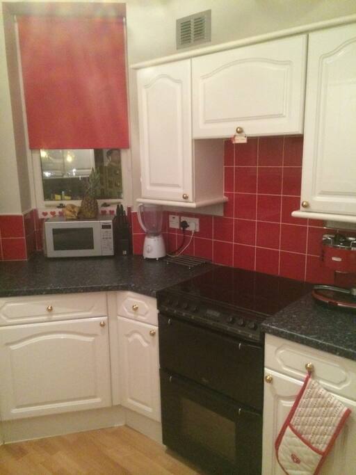 Kitchen includes microwave, washer, large fridge & freezer