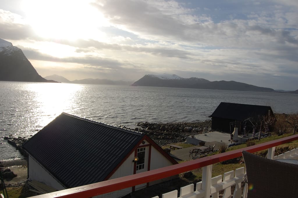 View from outdoor seating in front of cabin, and a view of the seating area down by the ocean which also can be used by guests when its available