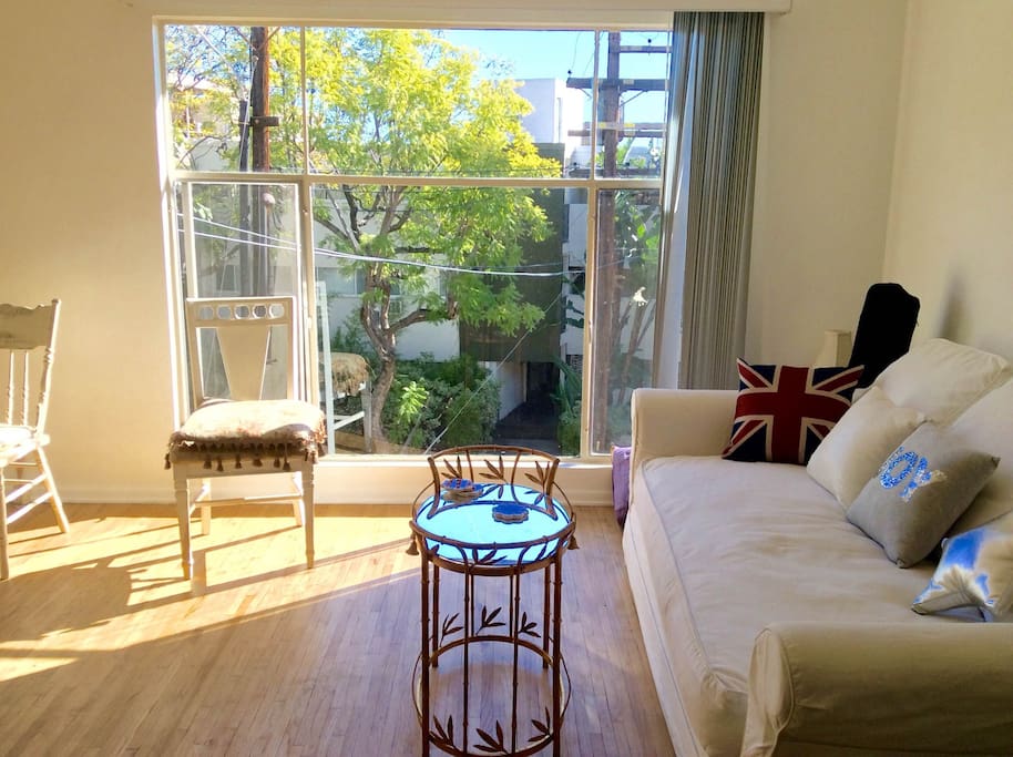Spacious living room, big windows and lovely view - large custom made queen size sleeper sofa