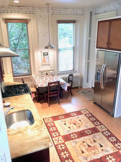 Eat in kitchen, custom cherry cabinets and counters, cork floors, stainless appliances, five burner stove, dishwasher, lots of storage