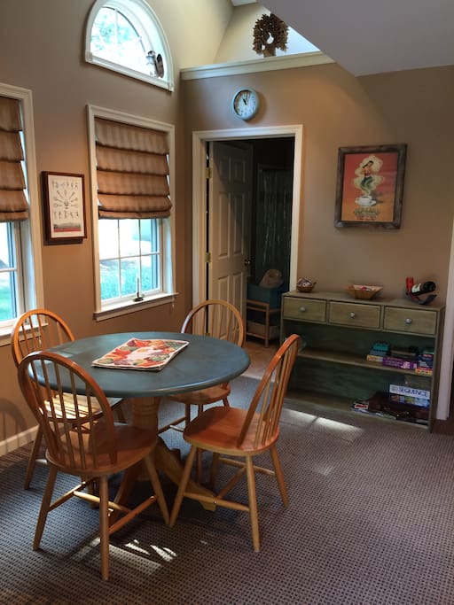 Well lit space for eating, working, or playing cards!