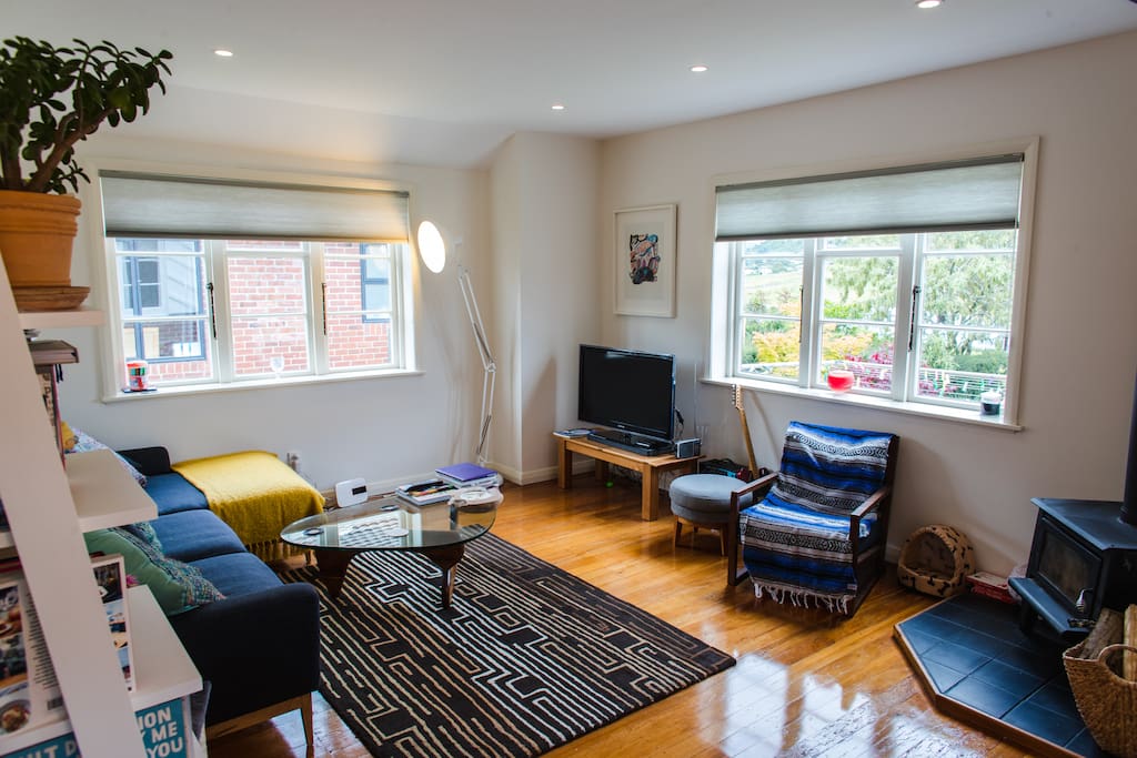 Polished wooden floors, lots of space on the couch and fire place in the corner