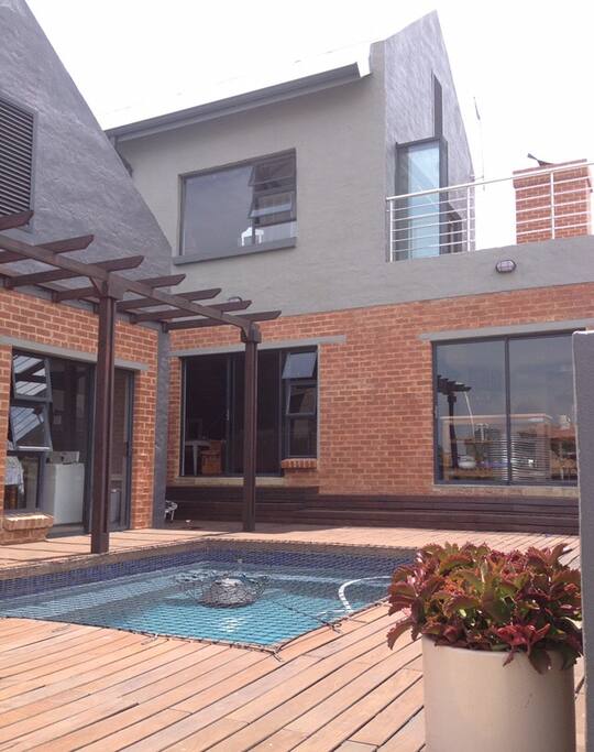 View from inside garden overlooking the pool