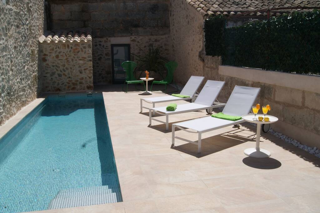 Pool area with sun beds