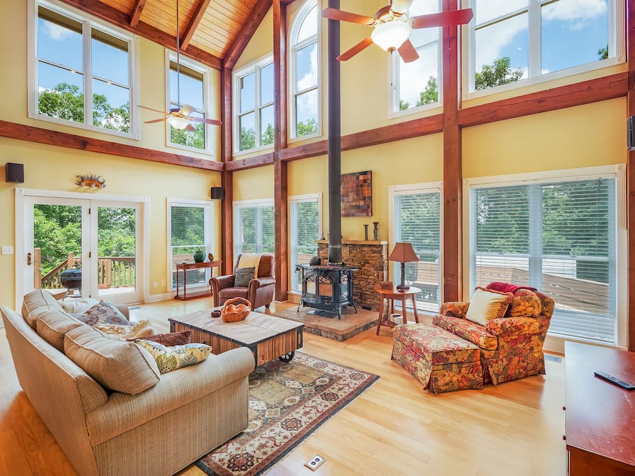 The great room with plenty of windows and a cathedral ceiling.
