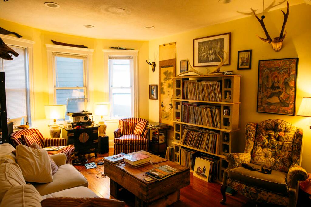 Homey and bohemian apartment with a projector for movies, and more records than you can count.