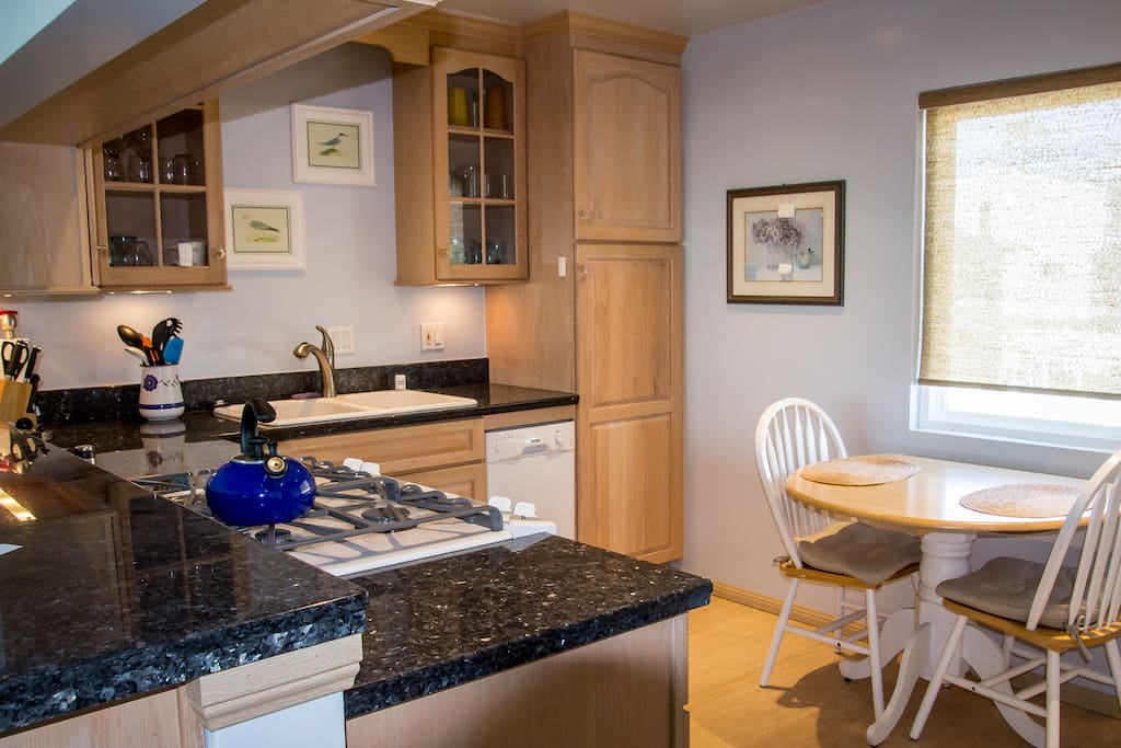 Fully stocked kitchen, small tablet to eat at, sunny & bright.