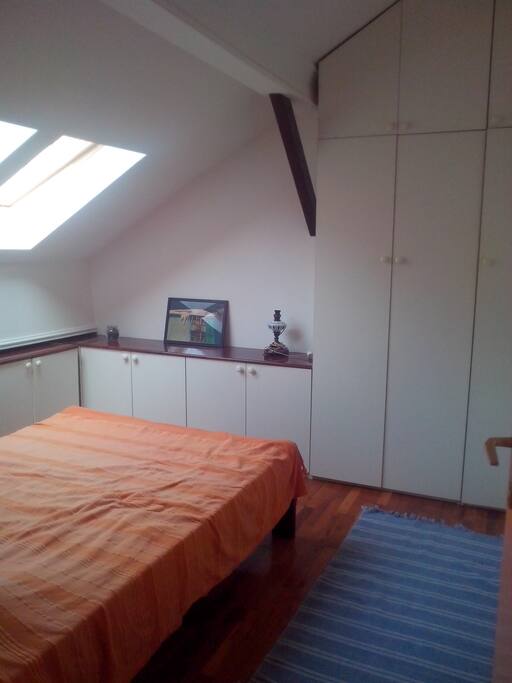 The cozy bedroom with lots of storage space.