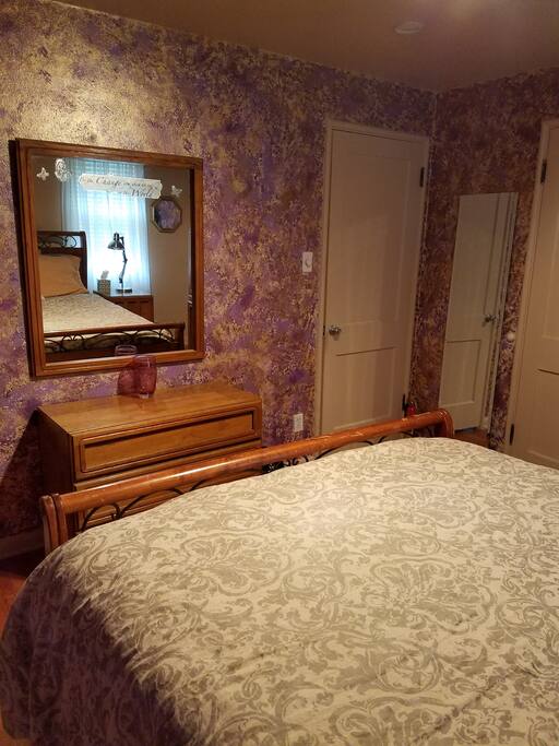 Private bedroom has lots of storage and mirrors