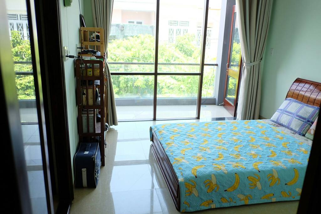 The private room where you will sleep, with street view, and the balcony