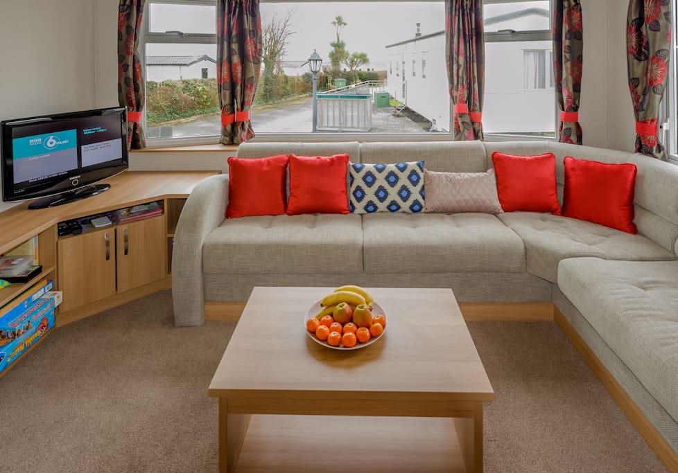 Living area (open plan to dining and kitchen). Includes TV with Sky and electric fire
