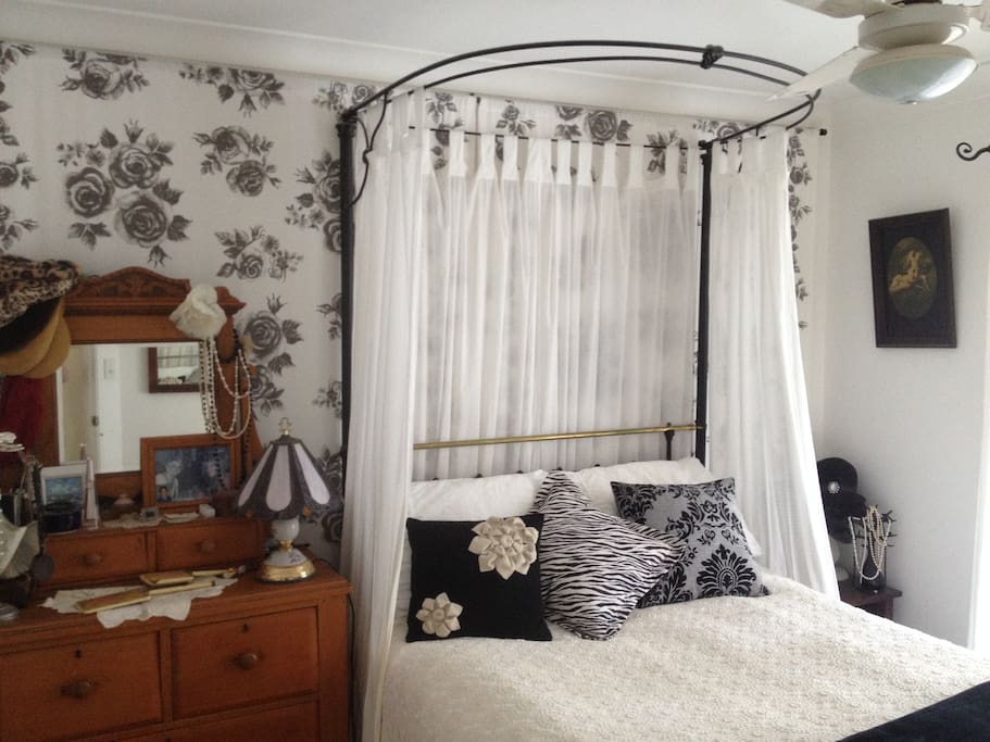 Romantic main bedroom featuring comfortable antique double bed