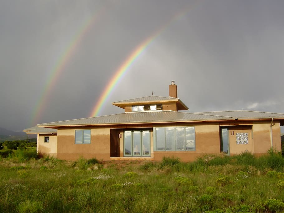 A year later, the house taken from the West with rainbows!