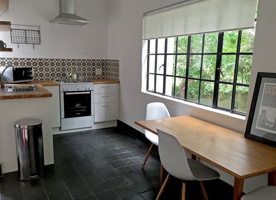 Kitchen with dining table and private garden view