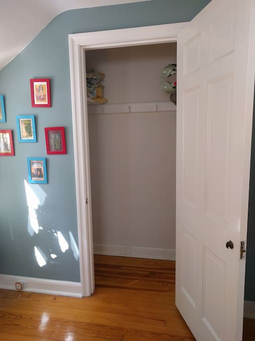 Double Bedroom closet with extra sheets and travel crib