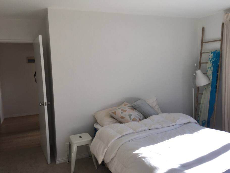 Bed down hallway to rest of home