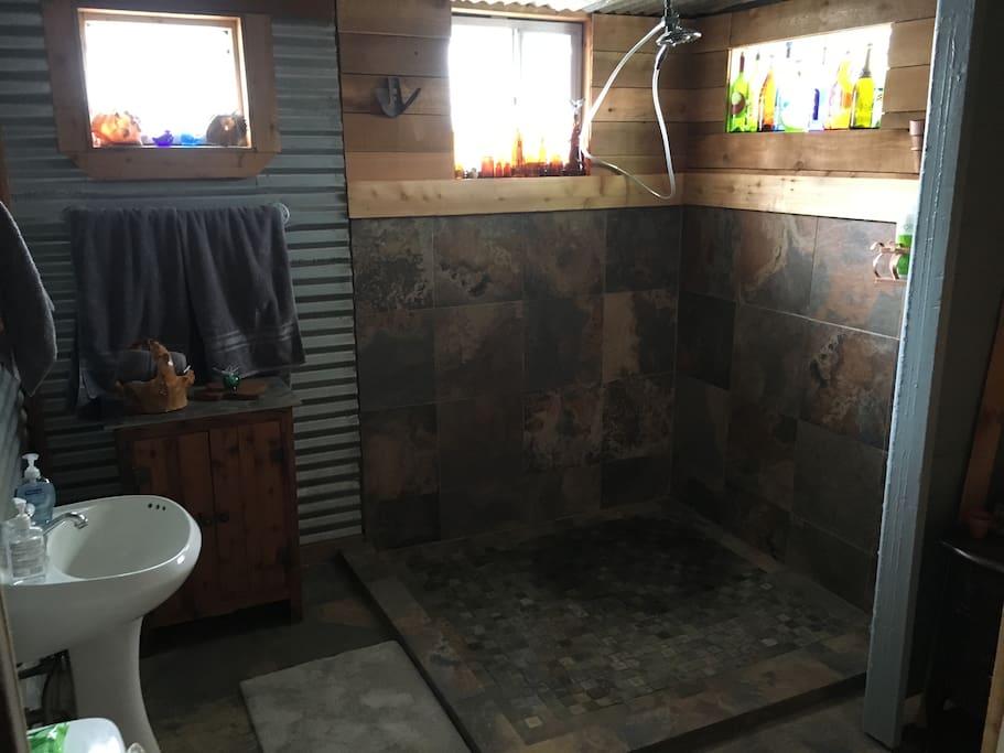 New downstairs rain shower and full bathroom.
