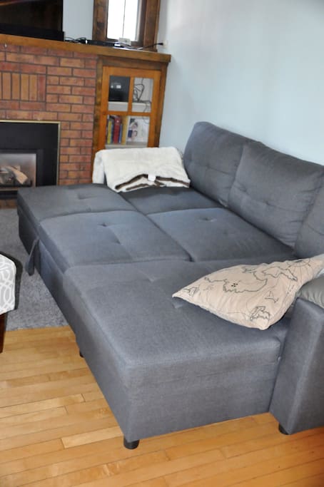 Couch pulls out to queen size bed (mattress pad provided)