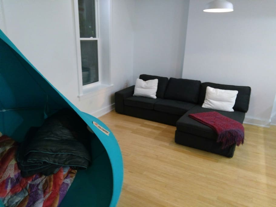 chill in the suspended pod or the sectional sofa. kensington market is right outside the window