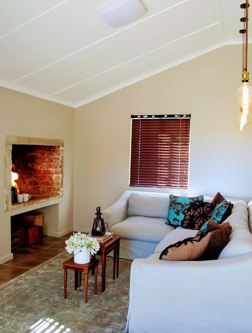 The living room with open fireplace.