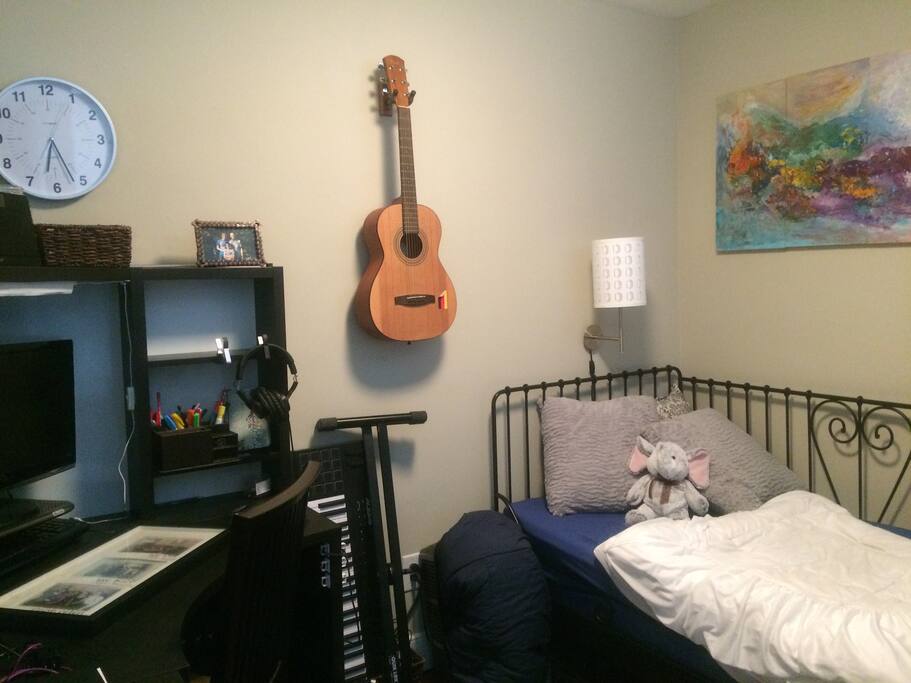 The den has a day bed and a floor mattress for additional guests