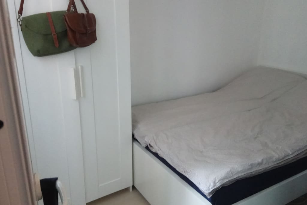 double bed, tv, cabinet, shelves