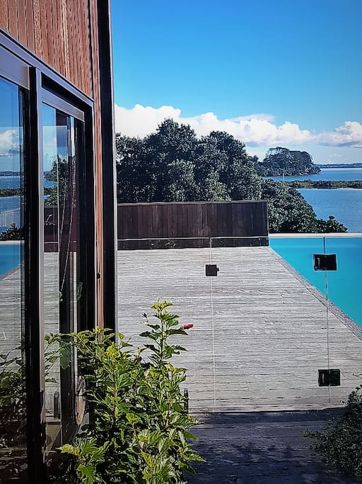 house, pool and sea beyond