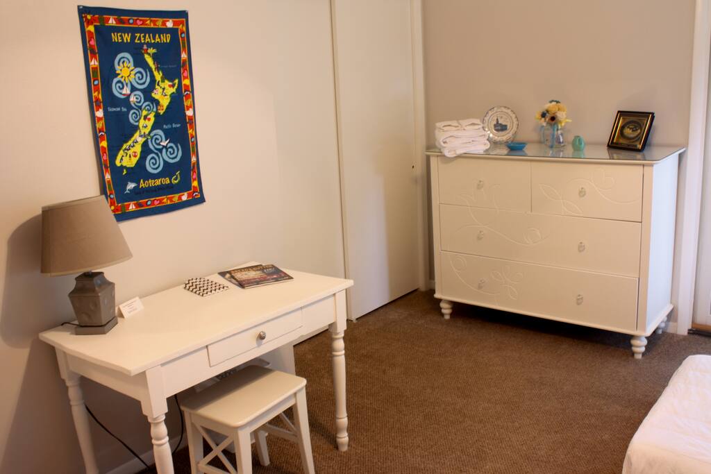 A desk and an empty dresser are available for you to store your things during your stay.