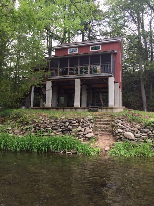 Screen porch with tempered glass gives a perfect creek view.