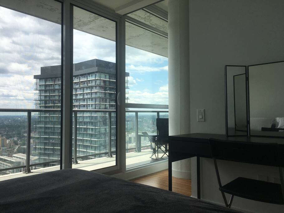 Balcony door can be accessed from bedroom! Guests can also feel free to use the desk and extra closet space.