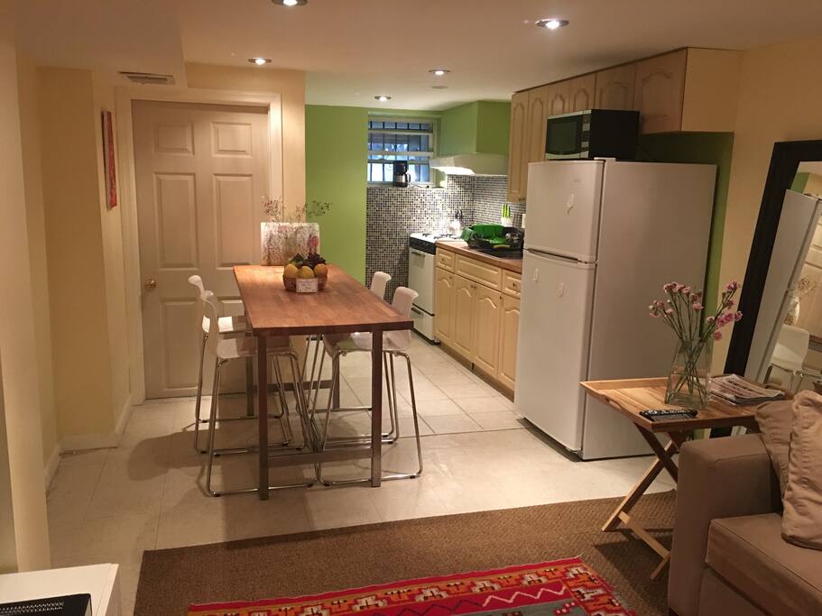 Open kitchen with butcher block bar counter high dinner table!
