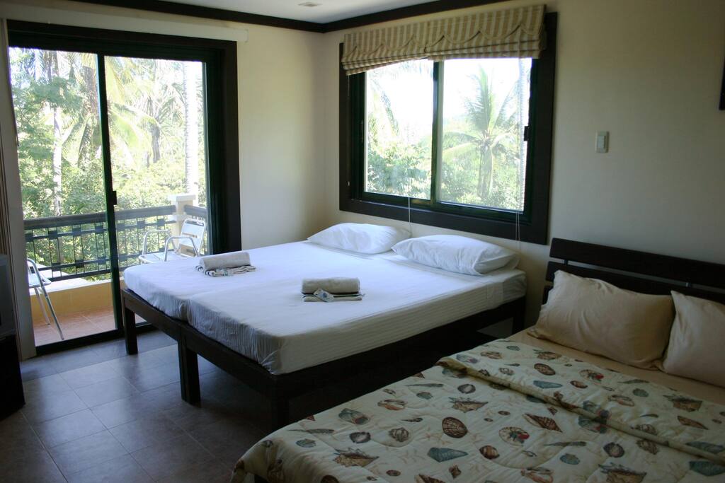 Second bedroom showing extra beds added for total six persons