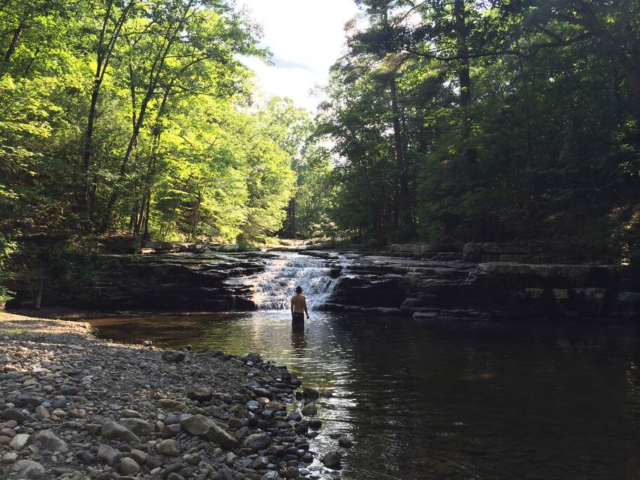 private swimming river with waterfall