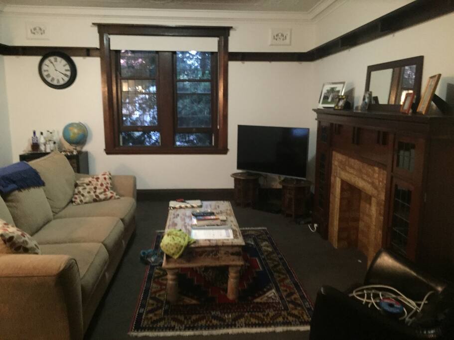 Living room with Foxtel, Netflix and Apple TV - opening up to veranda