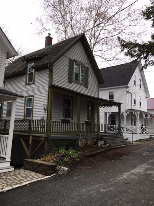2 story cottage with large wrap around porch